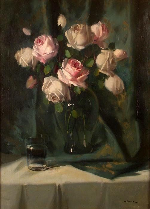 A still life of pink roses in glass